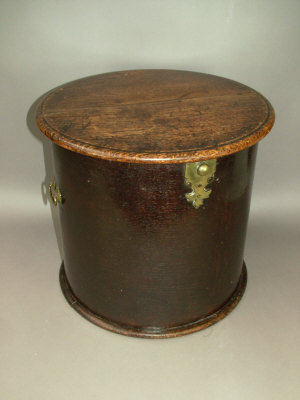 Appraisal: A th century drum shaped oak pot cupboard with brass