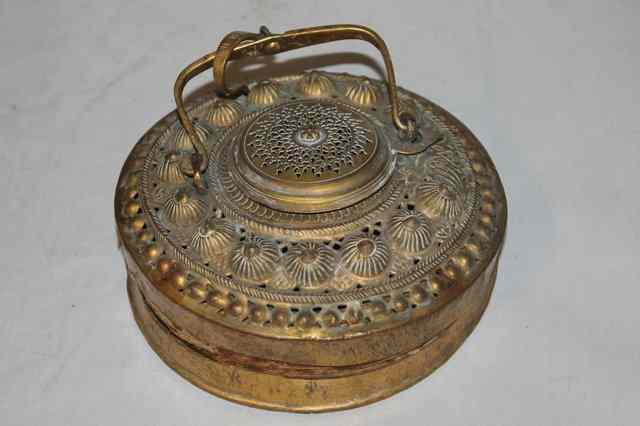 Appraisal: A BURMESE BRASS CONCERTINA LAMP with embossed roundels and pierced