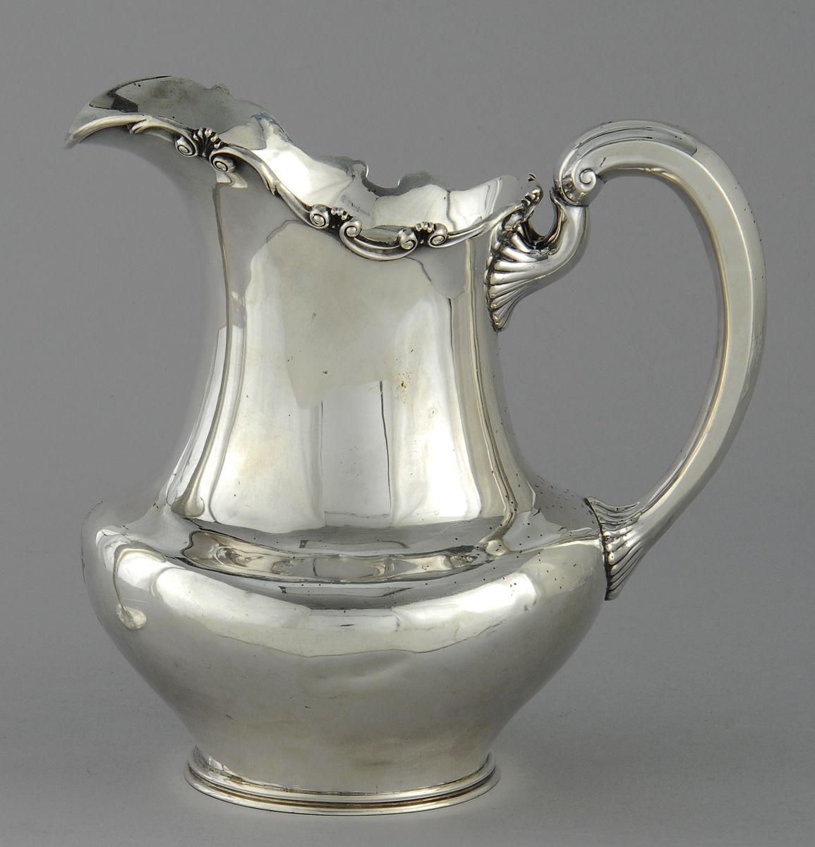 Appraisal: TOWLE STERLING SILVER PITCHER With applied scroll and shell rim