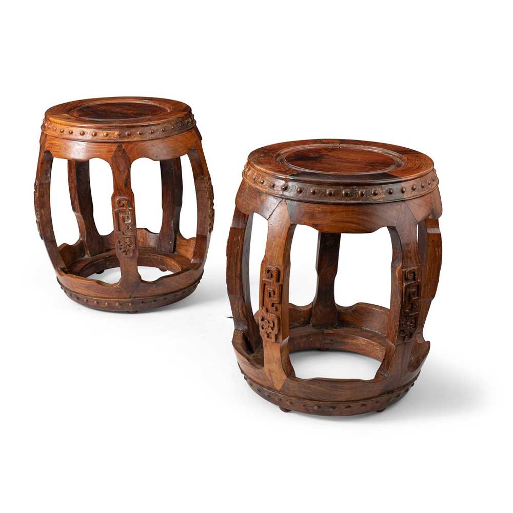 Appraisal: PAIR OF HUANGHUALI AND HARDWOOD CARVED DRUM FORM STOOLS QING