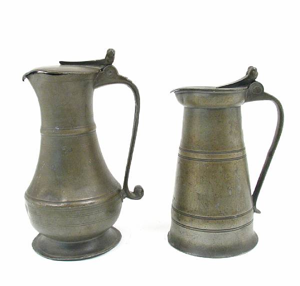 Appraisal: A group of two pewter pitchers with hinged lids height