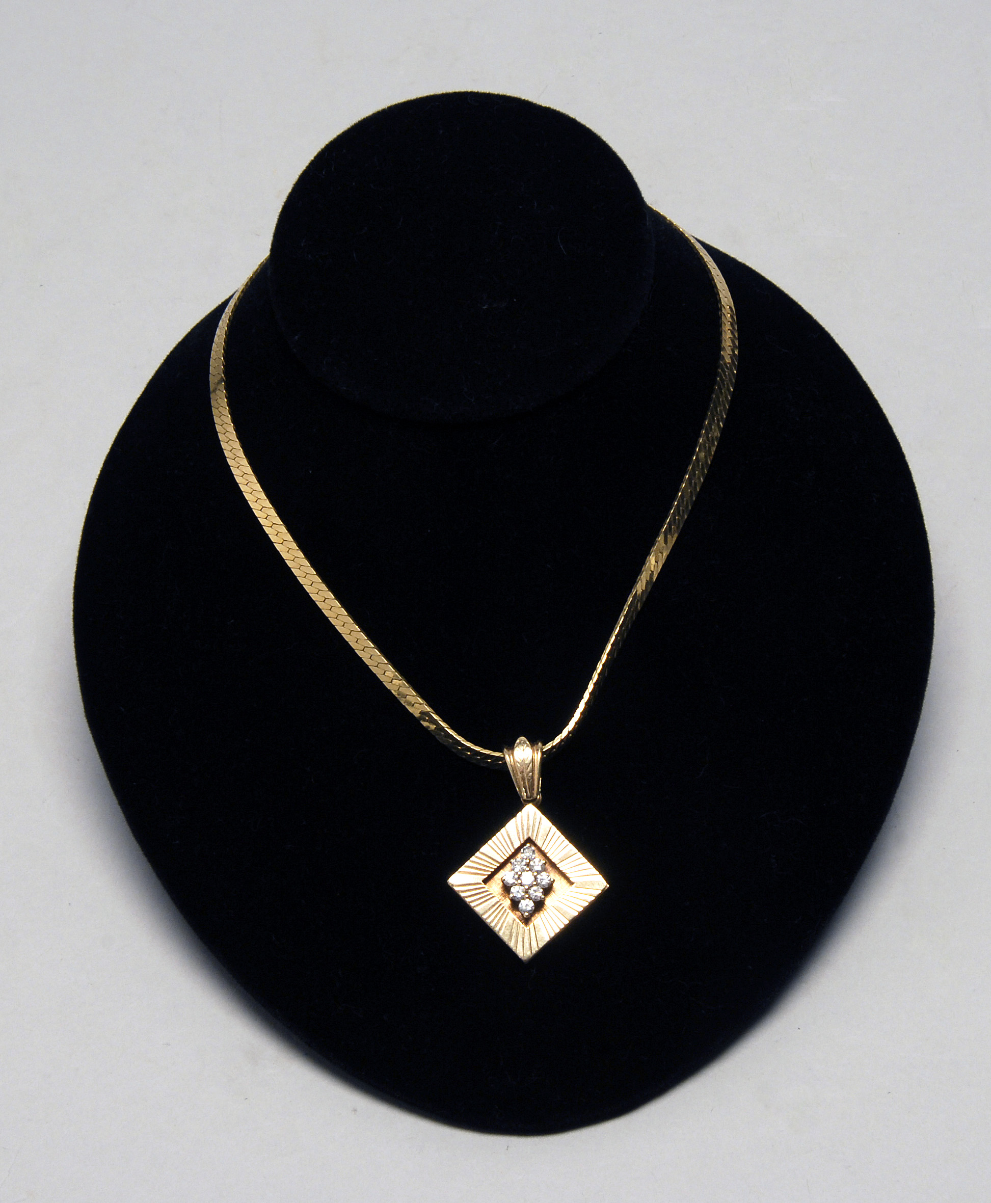 Appraisal: KT GOLD AND DIAMOND PENDANT WITH A KT GOLD NECKLACE