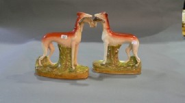 Appraisal: A pair of Staffordshire figures of a greyhound with a