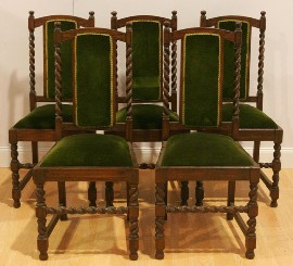 Appraisal: A set of six oak and upholstered dining chairs en