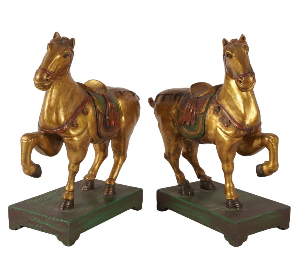 Appraisal: PAIR OF CARVED GILT PAINTED WOOD HORSES th century unsigned