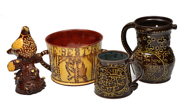 Appraisal: A LATE TH CENTURY STYLE SLIPWARE TWIN HANDLED LOVING CUP