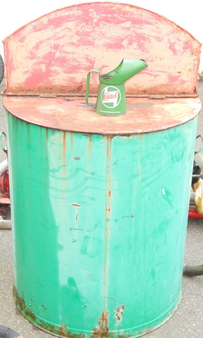 Appraisal: An oil drum dispenser cabinet