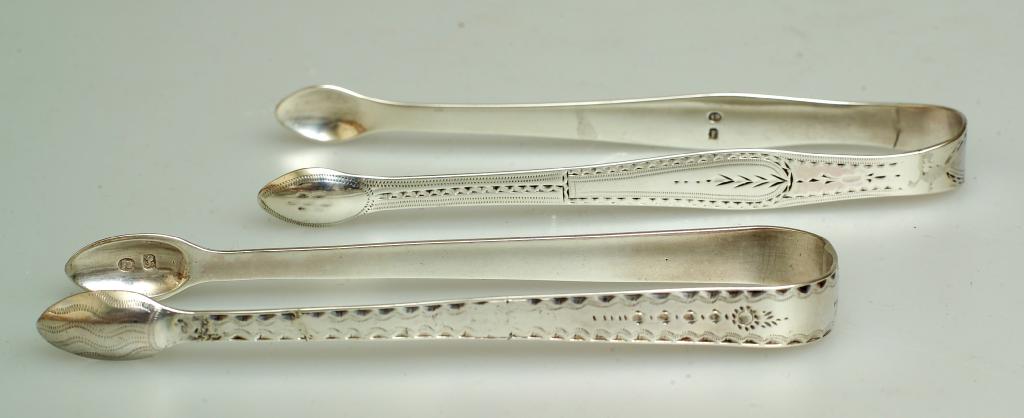 Appraisal: TWO PAIRS OF GEORGE III SILVER SUGAR TONGS Hester Bateman