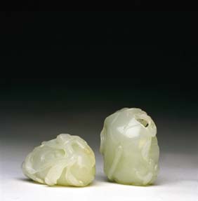 Appraisal: TWO ANTIQUE WHITE JADE TOGGLES Two antique Chinese carved pure