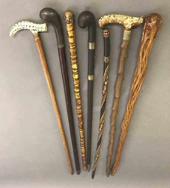 Appraisal: Seven Carved Canes Seven carved canes one with bone handle