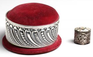 Appraisal: Antique Silver Pincushions Comprising a th century English velvet box