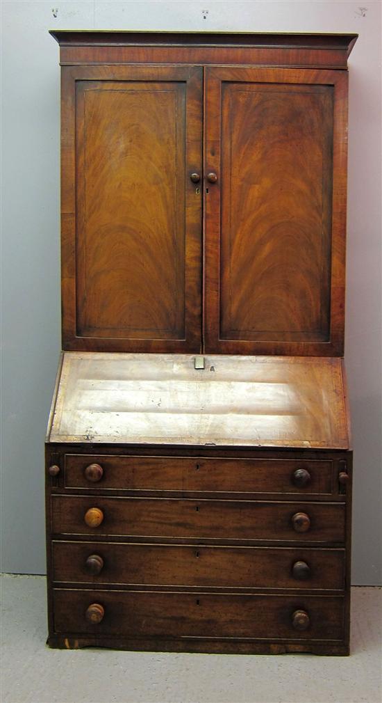 Appraisal: George III mahogany bureau bookcase the top with two panelled