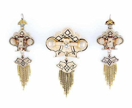 Appraisal: Victorian gold brooch and earrings suite circa cartouche-shaped set with