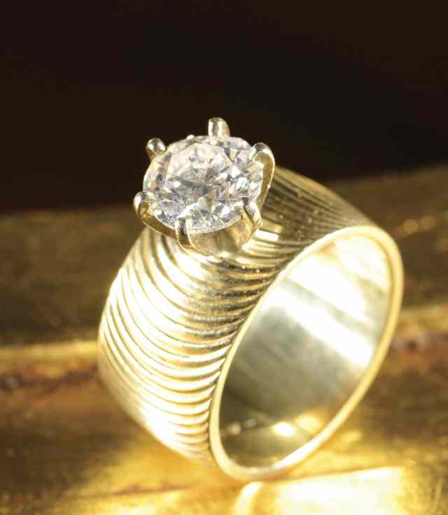 Appraisal: DIAMOND AND FOURTEEN KARAT GOLD SOLITAIRE RING with EGL diamond