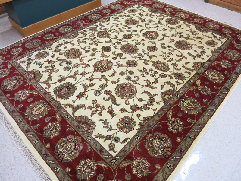 Appraisal: HAND KNOTTED ORIENTAL CARPET Indo-Persian Isfahan floral design on cream