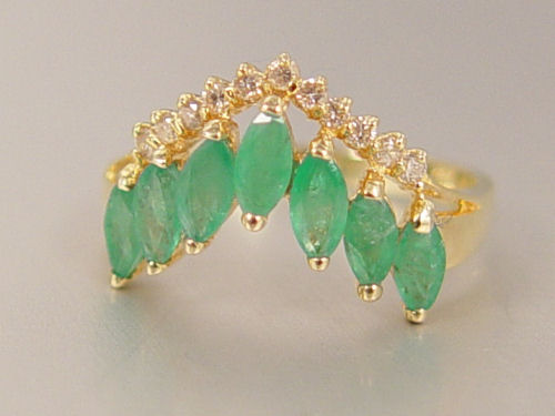 Appraisal: K EMERALD AND DIAMOND RING K yellow gold ring contains