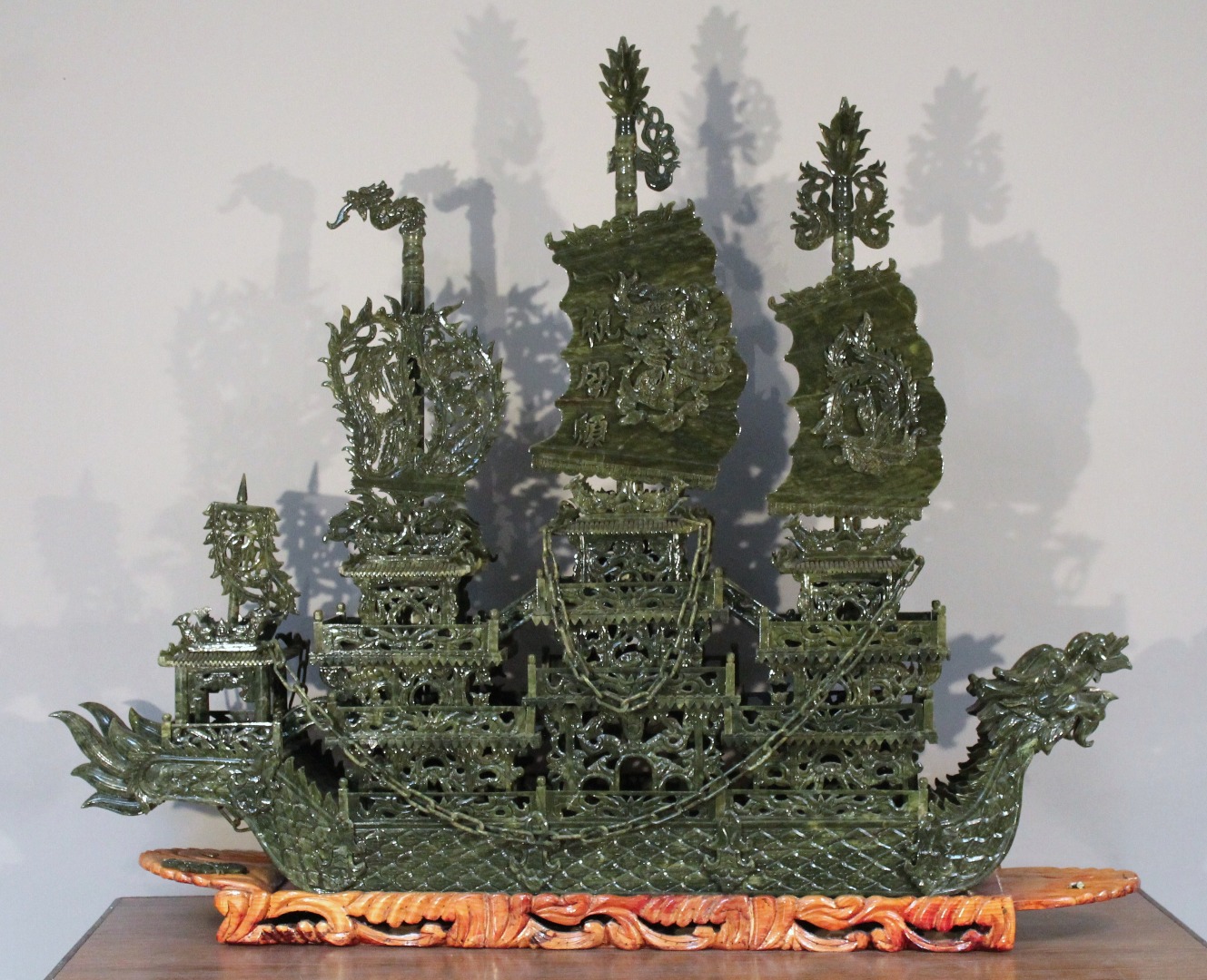 Appraisal: A thC spinach jade style carving of a Chinese ship