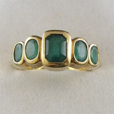 Appraisal: An emerald five stone ring set with five graduated emeralds