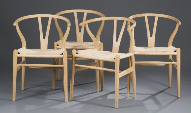 Appraisal: Four Hans Wegner Oak Wishbone Chairs Woven paper seats Made