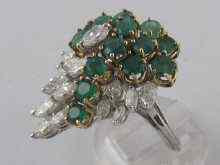 Appraisal: A hallmarked carat white gold emerald and diamond cluster ring