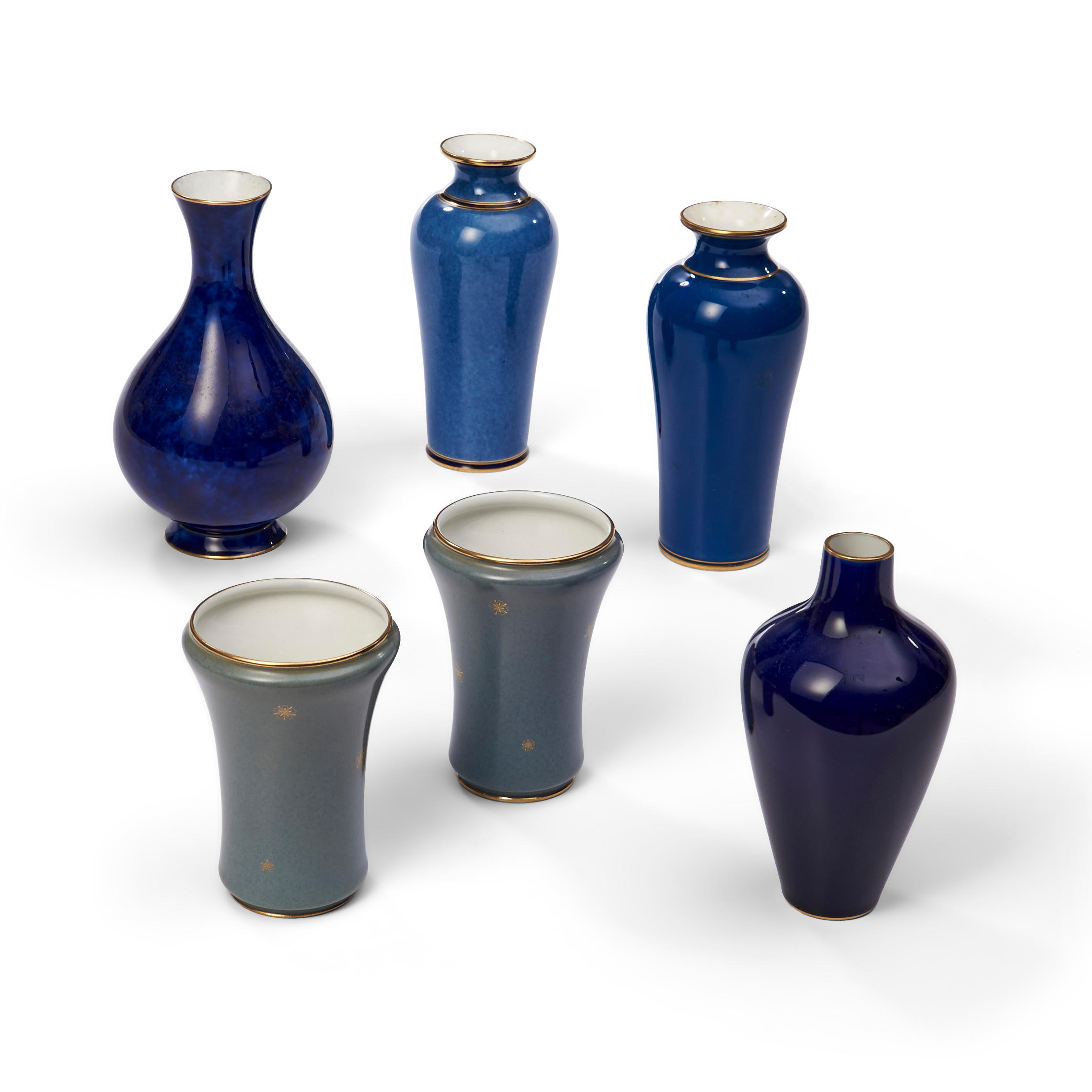 Appraisal: SIX MODERN SEVRES MONOCHROME VASES with gilt mouth and base