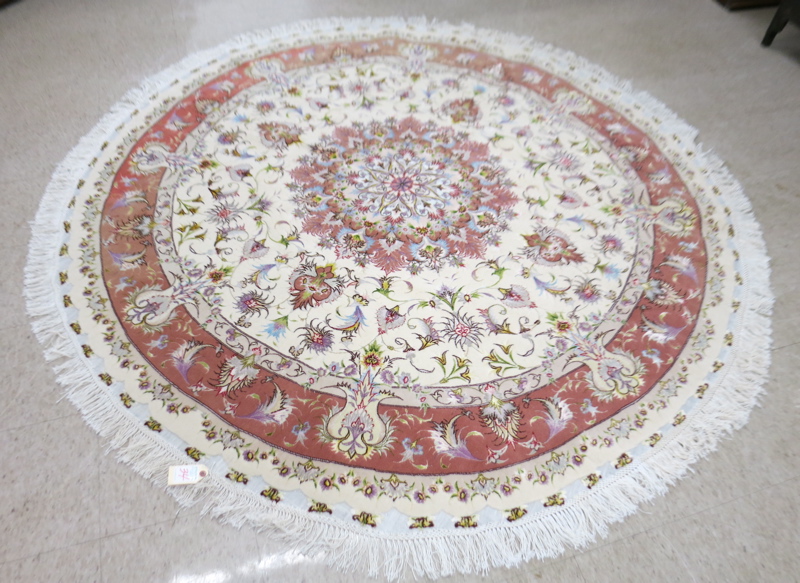 Appraisal: ROUND CONTEMPORARY PERSIAN WOOL AND SILK CARPET floral and central