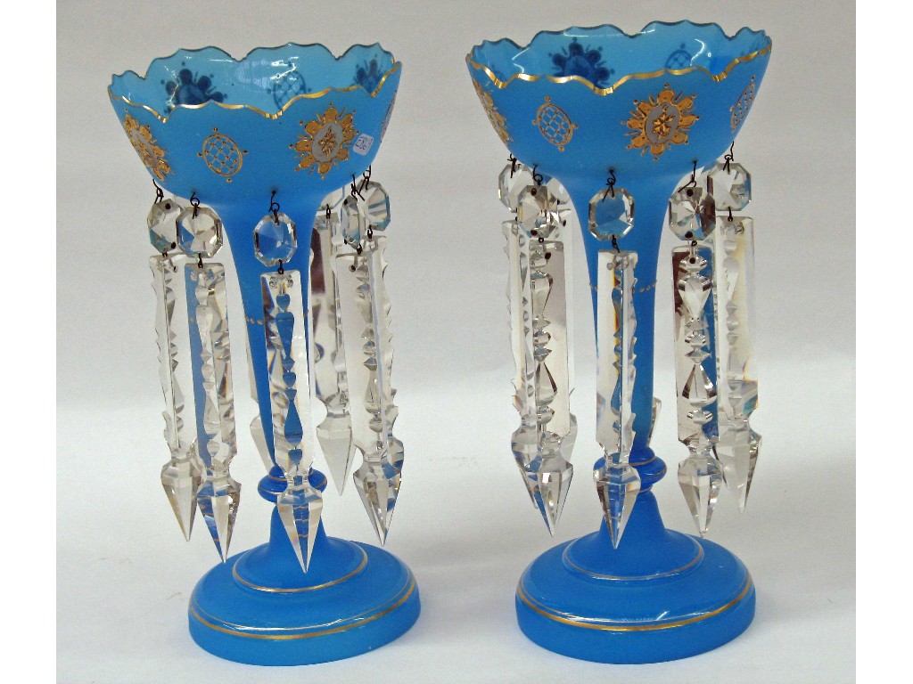 Appraisal: A pair of blue and clear glass table lustres with