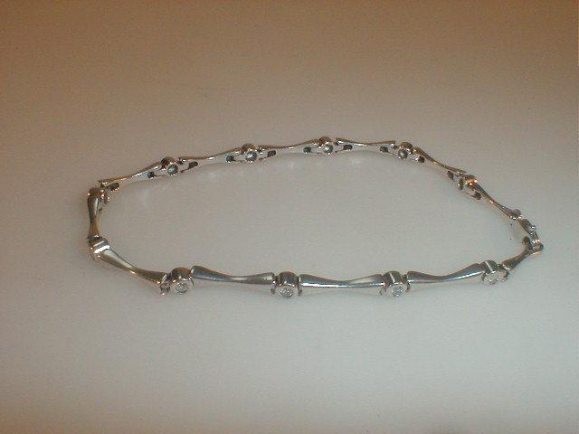 Appraisal: A white metal bracelet stamped of bars connected by small