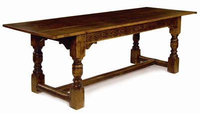 Appraisal: An oak refectory table the triple boarded cleated end top