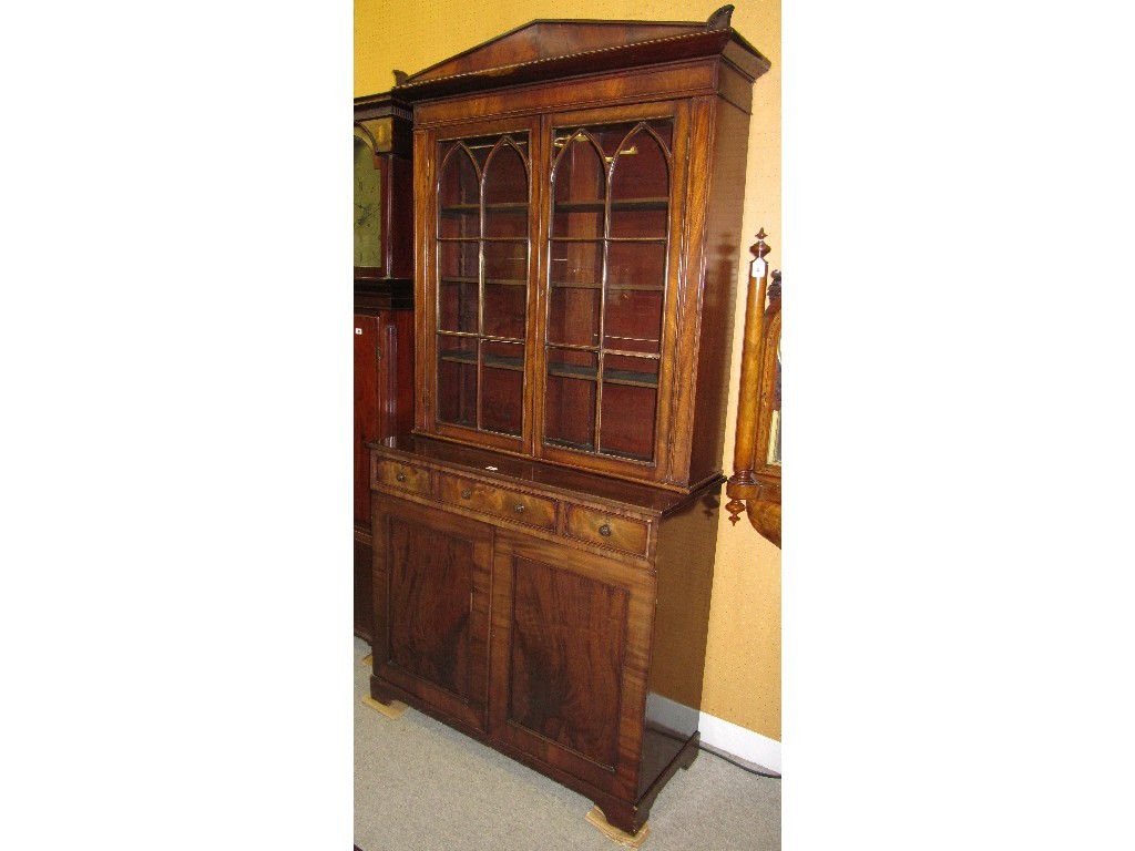 Appraisal: Regency mahogany bookcase on cabinet with gothic style astragals