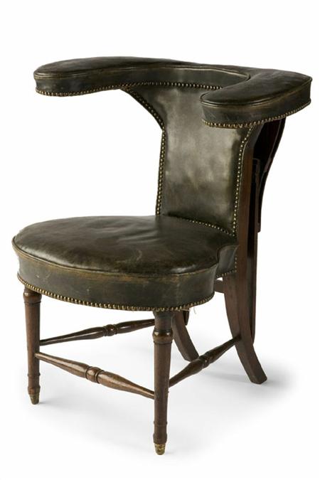 Appraisal: A Regency mahogany and studded green leather library armchair