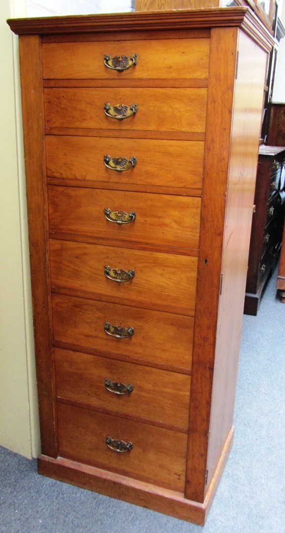 Appraisal: A th century soft wood Wellington chest with eight graduated