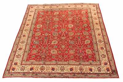 Appraisal: A Directional Tabriz Carpet Overall ruby red color with potted