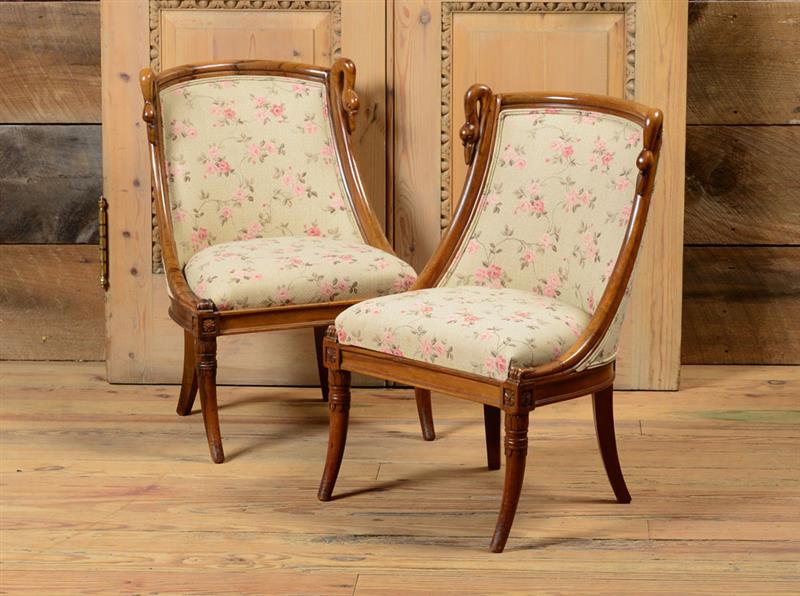 Appraisal: PAIR OF EMPIRE STYLE WALNUT PETIT CHAISES EN GONDOLE x