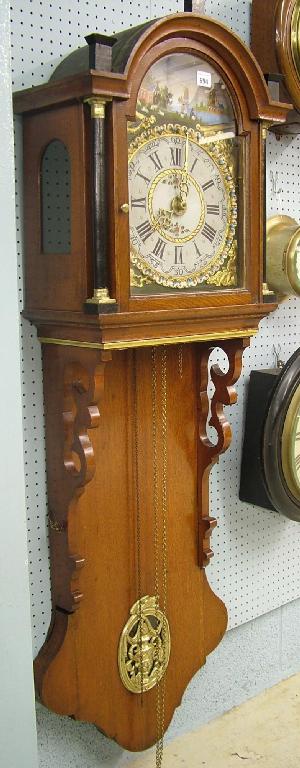 Appraisal: Dutch mahogany Staart thirty hour alarm wall clock the arched