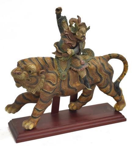 Appraisal: Chinese glazed pottery figural roof tile warrior astride a tiger