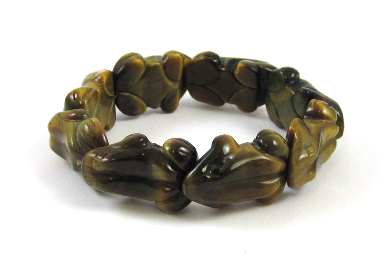 Appraisal: TIGER EYE FROG BEAD STRETCH BRACELET with eight carved frog