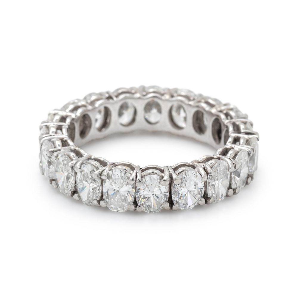 Appraisal: DIAMOND ETERNITY BAND DIAMOND ETERNITY BAND Containing oval brilliant cut