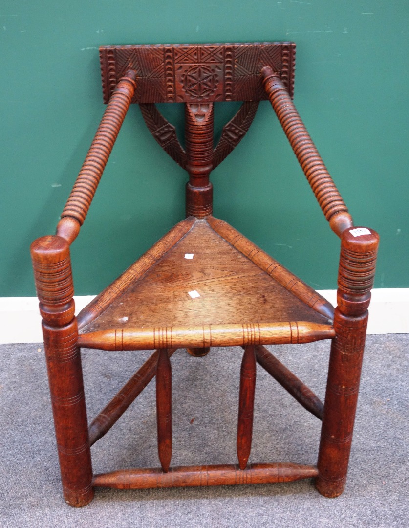 Appraisal: An Arts and Crafts oak turner's corner chair of th