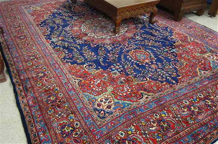 Appraisal: PERSIAN CARPET floral and central floral medallion design on dark