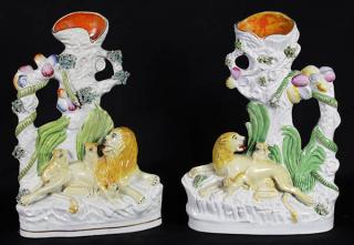 Appraisal: Pair of English Staffordshire figural spill vases depicting a recumbent