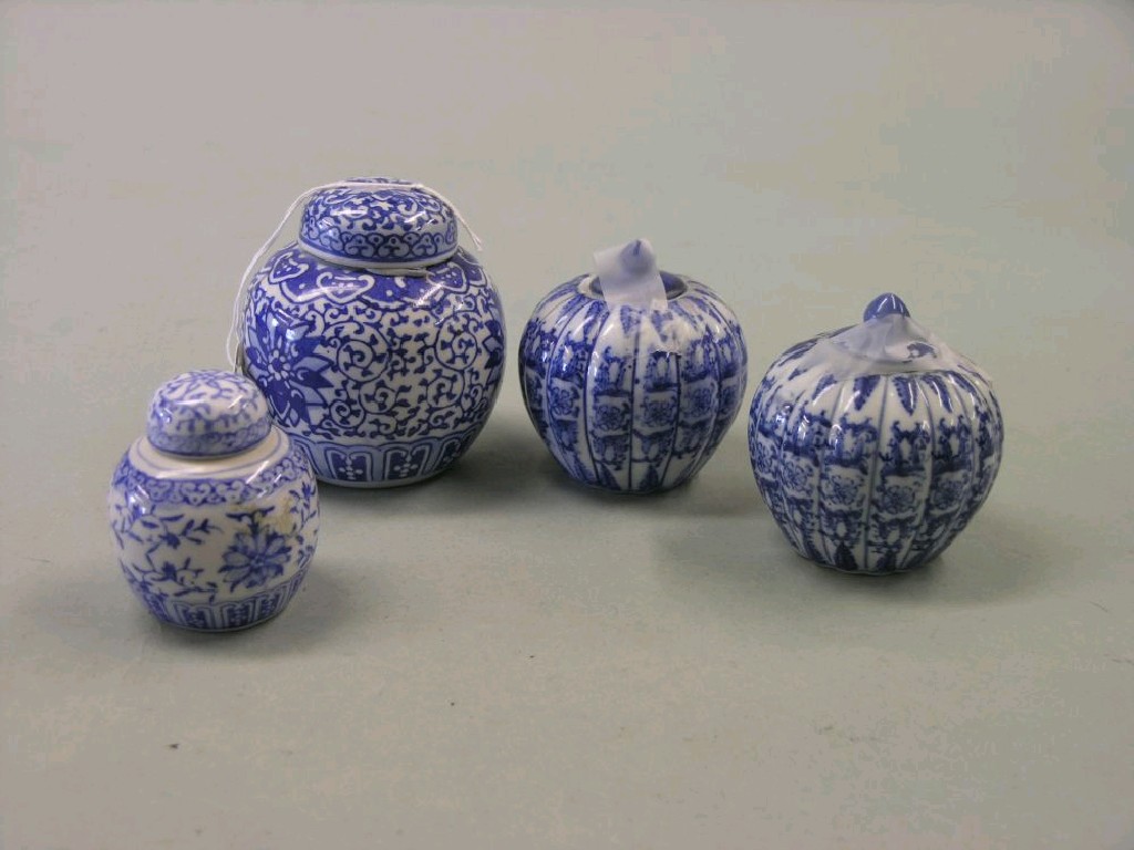 Appraisal: Four small Japanese porcelain jars each with cover painted in