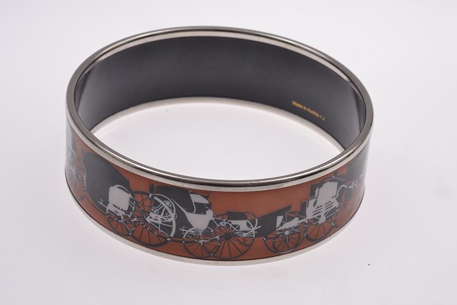 Appraisal: AN ENAMEL BANGLE BY HERMES BOXED