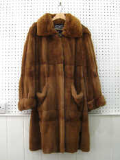 Appraisal: A Philip Hockly long fur coat with a hood Size