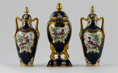 Appraisal: A Grainger Worcester garniture of three vases and covers painted