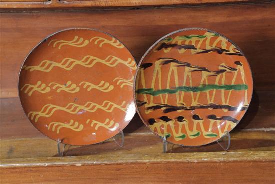 Appraisal: TWO GREG SHOONER REDWARE CHARGERS Each with slip decoration One