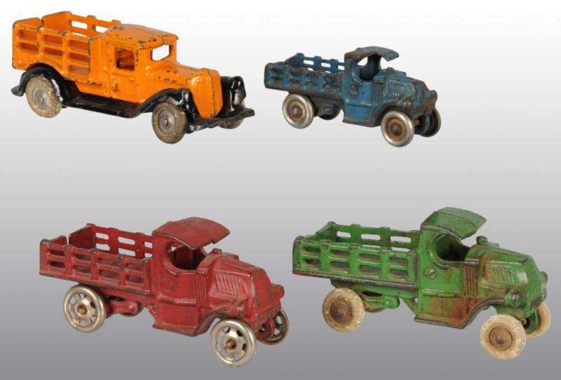 Appraisal: Lot of Cast Iron Stake Truck Toys Description American All