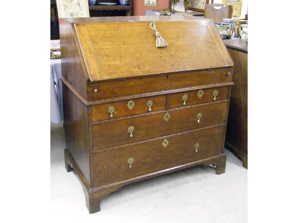 Appraisal: Early th century oak bureau the fall-front enclosing a fitted