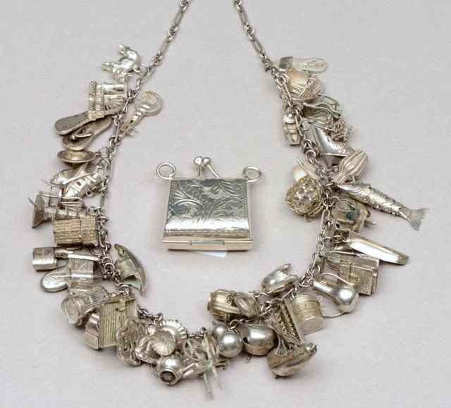 Appraisal: A CHINESE SILVER CHARM NECKLACE with numerous charms to include