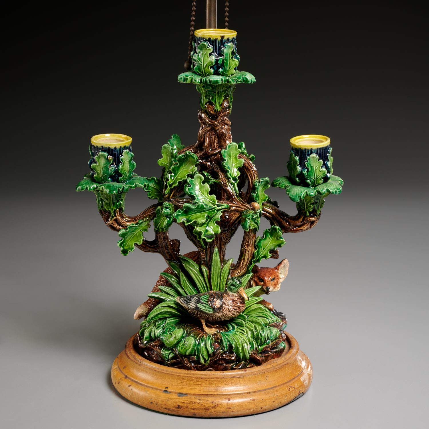 Appraisal: HUGO LONITZ MAJOLICA CANDELABRA CONVERTED TO LAMP c and adapted